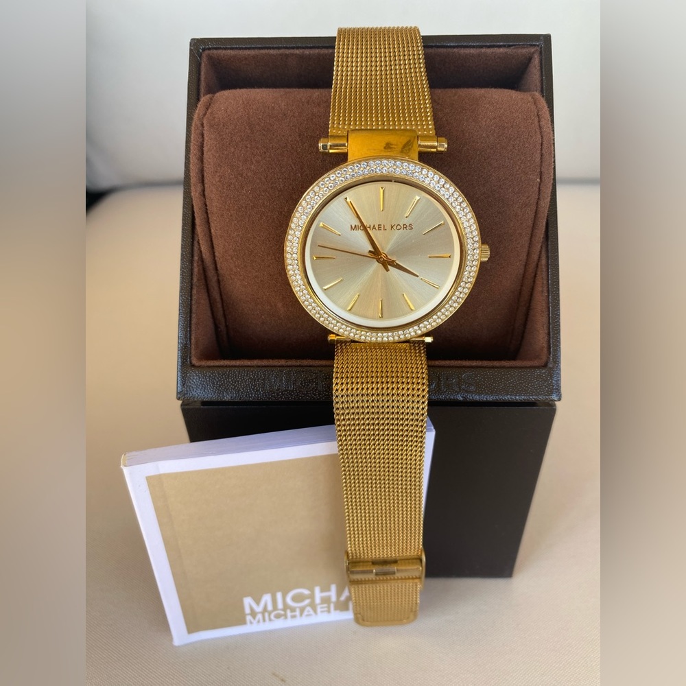 Michael’s Kors gold mesh band watch with double diamond bezel.